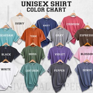 a group of different colored shirts hanging on a wall