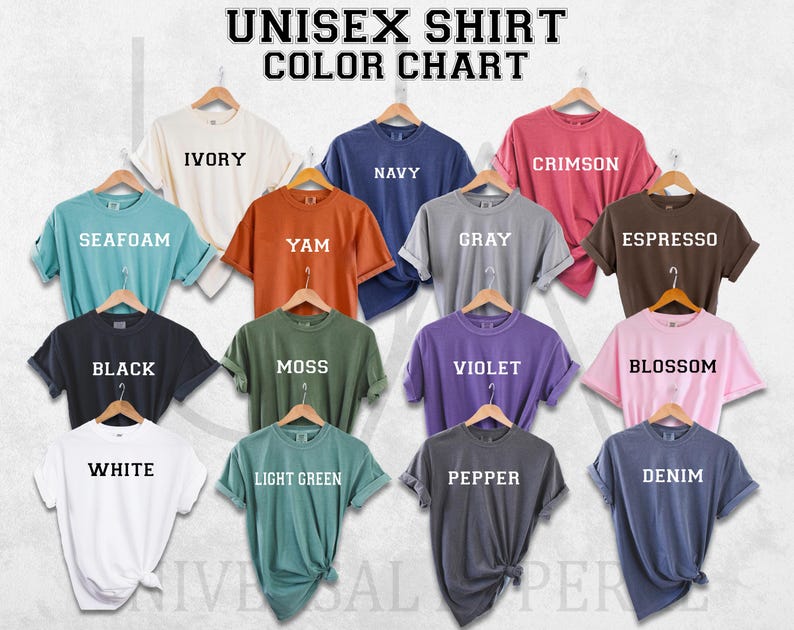 a group of different colored shirts hanging on a wall