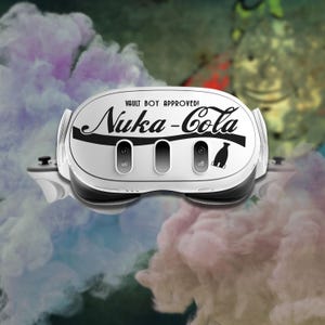 May include: White virtual reality headset with a black and white Nuka-Cola logo and the text "Vault Boy Approved!" printed on the front.