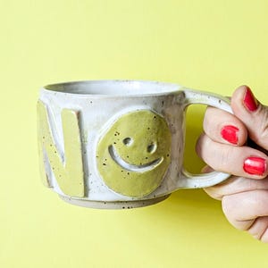 Pottery mug NO, KO or OK with smiley face, made of ceramic