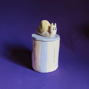 Ceramic lidded box with a snail-shaped knob
