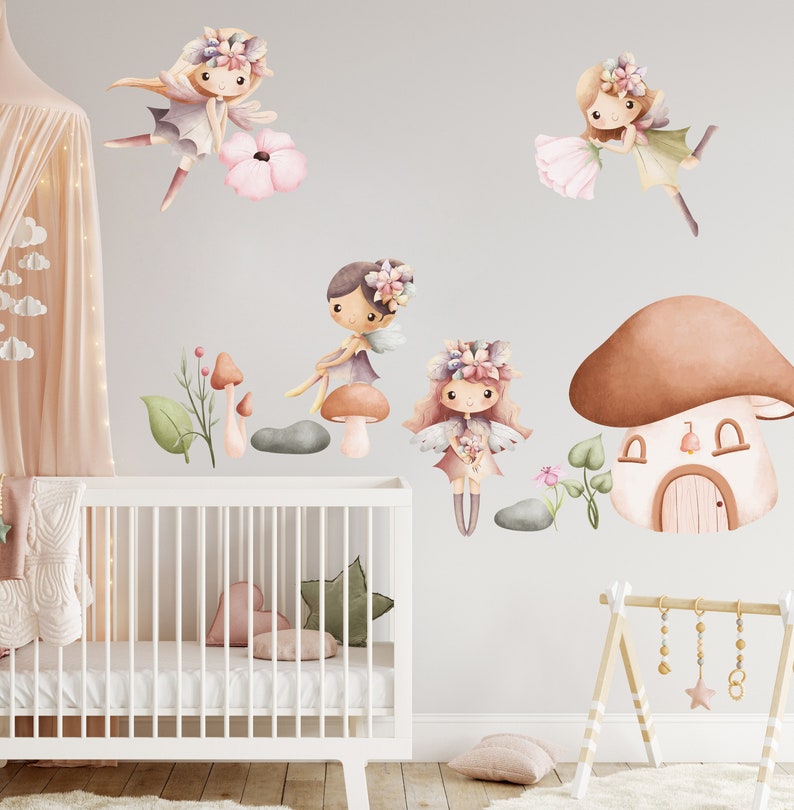 May include: A set of four watercolor fairy wall decals with mushroom houses, flowers, and leaves. The fairies are wearing floral crowns and have wings. The decals are perfect for a nursery or child's room.
