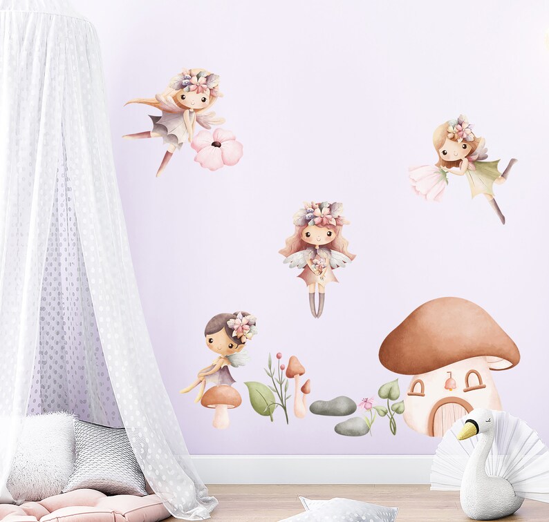May include: A set of four fairy wall decals with floral crowns and wings. The fairies are in various poses and are surrounded by flowers and mushrooms. The decals are perfect for adding a touch of whimsy to a child's room.