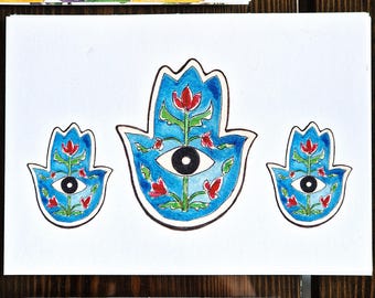 May include: Three watercolor paintings of the Hamsa hand, a symbol of protection, with a blue background, red flowers, and a black eye in the center.