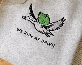 Funny Crewnecked Sweater, Embroidered Frog Sweatshirt, We Ride At Dawn Hoodie, Custom Gift for Fantasy and Book Lovers
