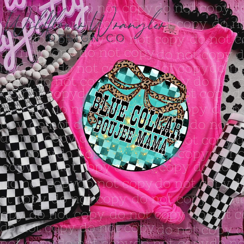 May include: A hot pink tank top with a graphic that says "BLUE COLLAR BOOJEE MAMA". The graphic has a turquoise checkered background and a leopard print bow. Black and white checkered shorts are next to the tank top.