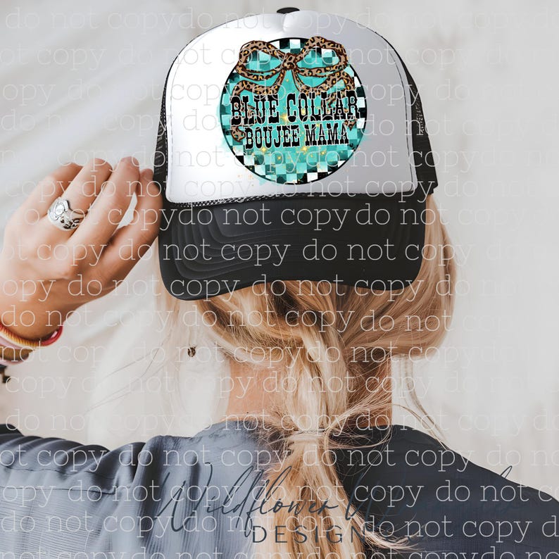 May include: Black and white trucker hat with a white front panel. The hat features a circular design with the text "BLUE COLLAR BOUJEE MAMA" in a turquoise and leopard print design. The hat is worn by a person.