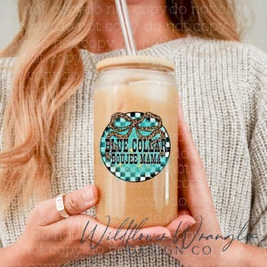 May include: A clear glass tumbler with a bamboo lid and a straw, filled with a light-colored beverage. The tumbler features a circular design with the text "BLUE COLLAR BOUJEE MAMA" in a turquoise and leopard print pattern.