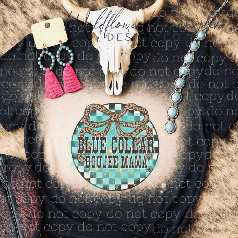 May include: Black t-shirt with a bleached design and the text "BLUE COLLAR BOUJEE MAMA" in a turquoise and leopard print design. The image also shows turquoise earrings, a turquoise necklace, and a cow skull.