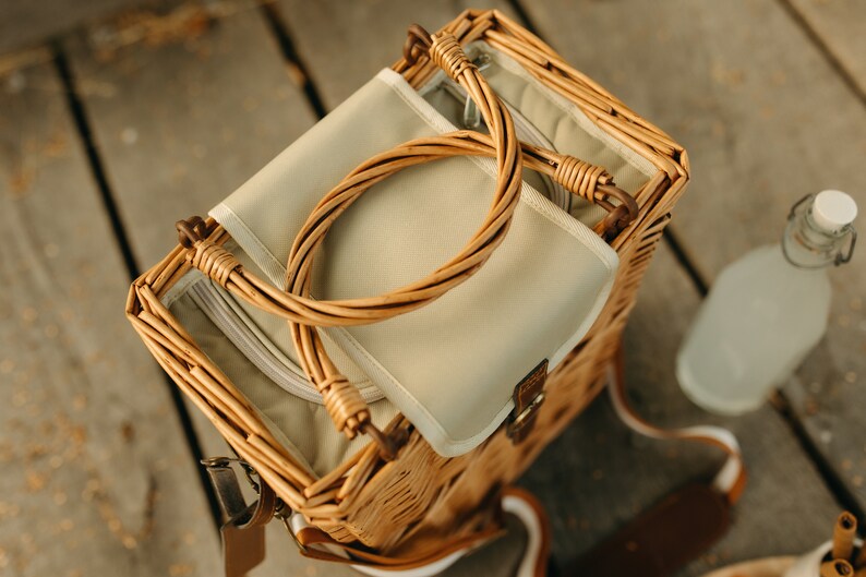 The handiwork on this handmade picnic basket is so lovely! And it is also so very practical. The top of the basket makes a great storage spot for kindles, phones, keys, baby monitors etc. when you are out and about.