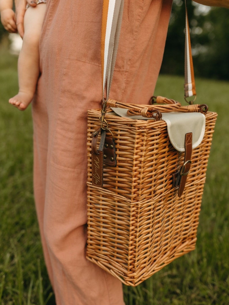 The padded shoulder strap makes it easy to carry so your hands are free to carry whatever else you may have with you...like a baby. This is also a great insulated grocery bag or farmers market basket.