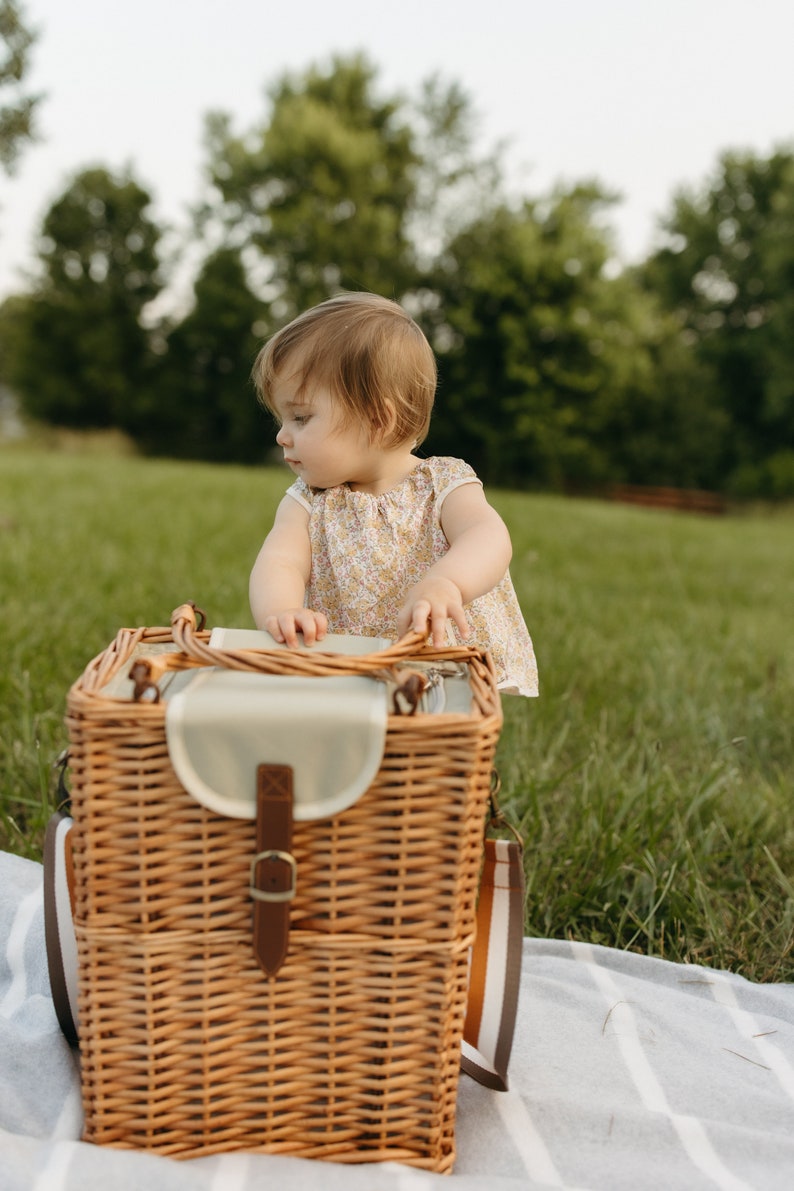 Babies can also use this wicker picnic basket to cruise after eating their lunch.