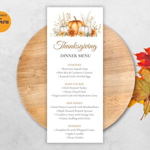 May include: Thanksgiving dinner menu with watercolor pumpkins and fall foliage. The menu includes starters, main courses, side dishes, and desserts. The menu is on a white background and is placed on a wooden cutting board.