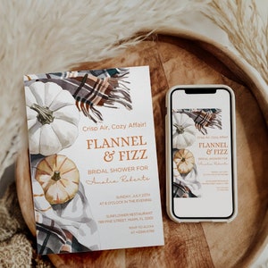 May include: A bridal shower invitation featuring a watercolour illustration of pumpkins and a plaid blanket. The invitation reads "Crisp Air, Cozy Affair! Flannel & Fizz Bridal Shower for Amalia Roberts" with the date, time, and location.