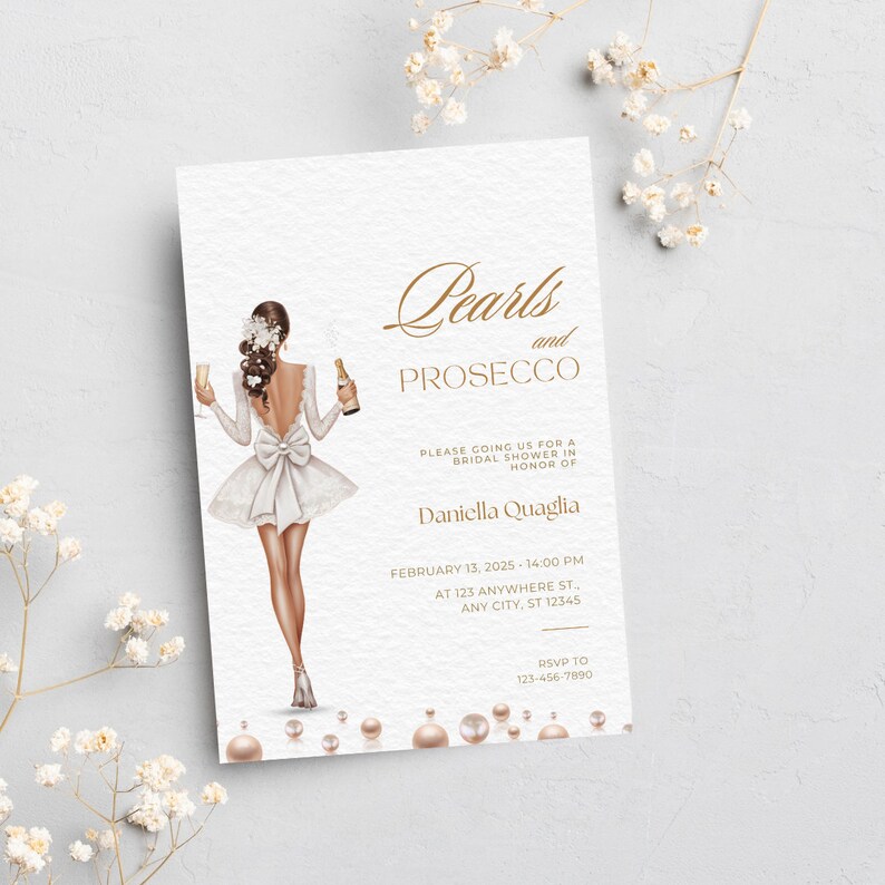May include: A bridal shower invitation with a gold and white color scheme. The invitation features a woman in a white dress holding a glass of champagne and a bottle of champagne. The text on the invitation reads "Pearls and Prosecco" and includes the date, time, and location of the event. RSVP information is also included.
