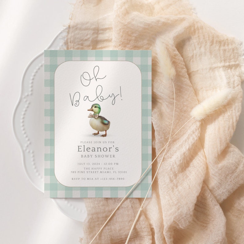 May include: A baby shower invitation with a green and white gingham pattern. The invitation features a cartoon duck wearing a bow tie and the text "Oh Baby!"  "Please join us for Eleanor's Baby Shower"  "July 13, 2024 - 12:00 PM"  "The Happy Place"  "789 Pine Street Miami, FL 33101"  "RSVP to Mia at 123-456-7890"
