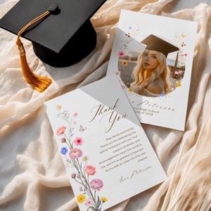 May include: Graduation thank you cards with floral accents and a photo of a graduate wearing a cap. The cards feature the text "Thank You" in elegant script and personalized details.