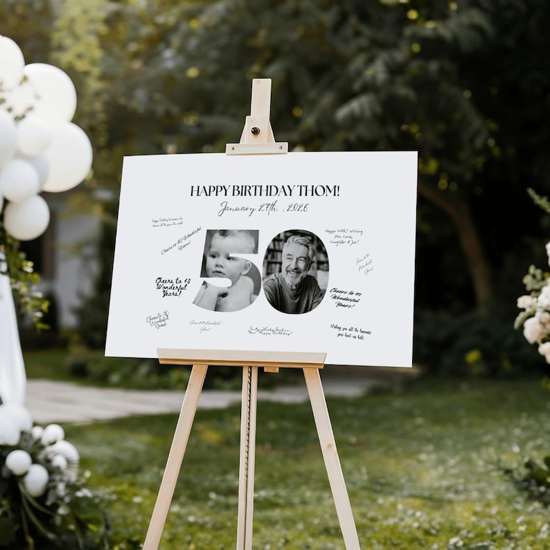 May include: A white sign on a wooden easel with the text "HAPPY BIRTHDAY THOM!" and "January 8th, 2026". The sign has a black and white photo of a baby and an adult, with the number "50" and handwritten messages.
