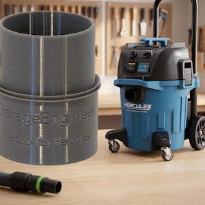 May include: A gray cylindrical vacuum adapter featuring the embossed text GarageEngineer and Festool to Hercules, positioned next to a blue and black Hercules shop vacuum and a black vacuum hose with a green ring on a wooden surface.