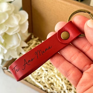 The leather keychain is engraved with your personalized message