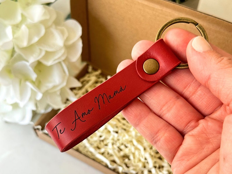 The leather keychain is engraved with your personalized message