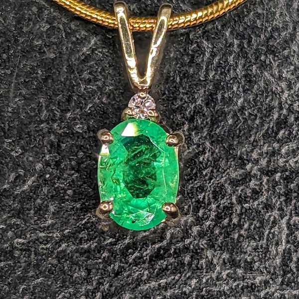 Emerald 7x5mm Oval Solid 14k Pendant w/.02 ct. Diamond