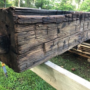 Hand hewn and saw blade cut beams and timbers