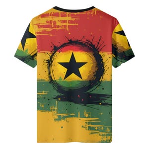 May include: A short-sleeved t-shirt featuring the Ghana flag design. The shirt has a black crew neck and a colorful graphic of the flag's colors: red, yellow, green, and a black star in the center. The design has a distressed, grunge style.