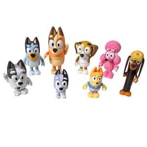 May include: A selection of eight dog character figurines. The collection features various breeds, including a blue heeler and a poodle. Each figure is brightly colored and cartoon-like, with distinct features and poses, perfect for children's play or collecting.