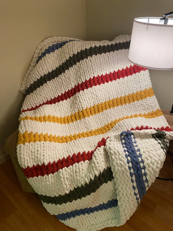 Multicolored striped chunky knit blanket