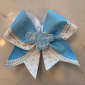 Custom bow, glitter, rhinestone accents, name center, personalized name.