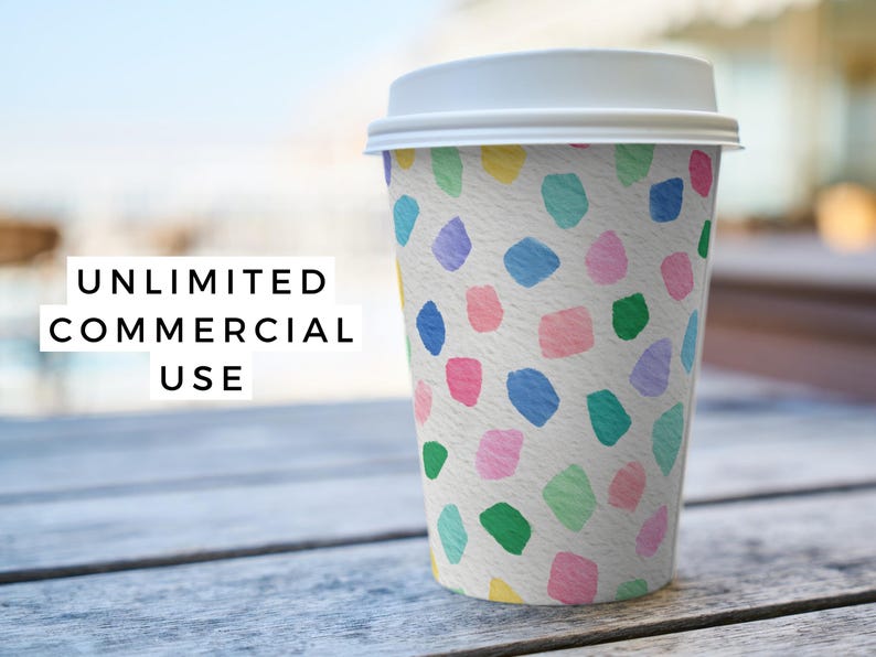 May include: A white paper coffee cup with a white lid, decorated with colorful abstract shapes in blue, green, pink, purple, and yellow. The text "UNLIMITED COMMERCIAL USE" is displayed in a white box.