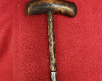 Ball starter with wooden handle.