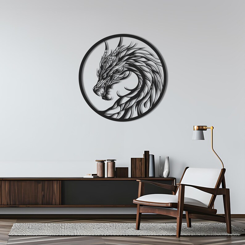 May include: A black metal dragon wall art piece. The dragon is depicted in profile within a circular frame. The artwork features intricate details, including the dragon's scales, horns, and flowing mane. The dragon's head is turned to the left, with its mouth slightly open.