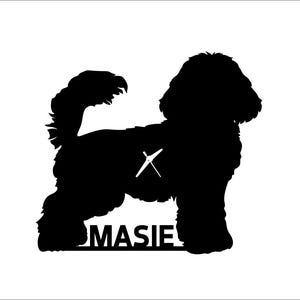 May include: Black silhouette of a dog with a fluffy coat, tail, and head. A clock is in the center of the dog's body. The name "MASIE" is at the bottom of the dog.