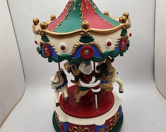 Carrusel musical de villancicos de Papá Noel, nuevo, de la colección Avon Gift Collection, 23 cm de alto.