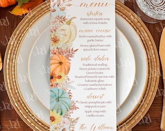 Puede incluir: Una tarjeta de menú rectangular vertical con una ilustración en acuarela de calabazas, girasoles y hojas de otoño. El texto enumera los platos de la cena de Acción de Gracias, incluyendo entrantes, plato principal, guarniciones y postre para The William 2025.