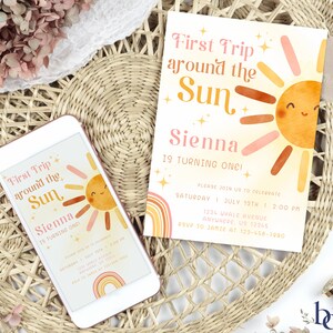 May include: A digital invitation for a first birthday party with a sun and rainbow theme. The invitation says "First Trip Around the Sun Sienna is turning one!" and includes the date, time, and RSVP information.