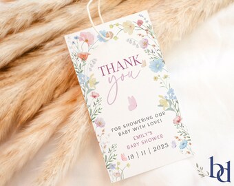 May include: A white thank you tag with a floral border and a pink bunny illustration. The text reads "Thank you for showering our baby with love! Emily's Baby Shower 18|11|2023".