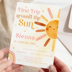 May include: A colourful invitation card with a sun illustration and the text "First Trip around the Sun Sienna is turning one!" Please join us to celebrate Saturday, July 13th at 2:00 PM. 1234 Whale Avenue, Anywhere, US 12345. RSVP to Jamie at 123-456-7890.