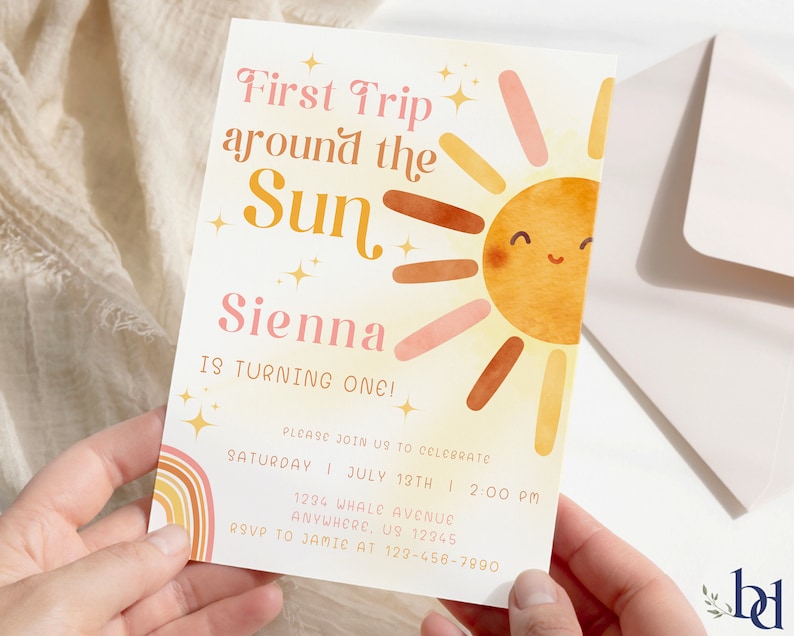 May include: A colourful invitation card with a sun illustration and the text "First Trip around the Sun Sienna is turning one!" Please join us to celebrate Saturday, July 13th at 2:00 PM. 1234 Whale Avenue, Anywhere, US 12345. RSVP to Jamie at 123-456-7890.
