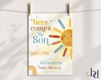 Könnte beinhalten: Eine gelbe Sonne mit einem lächelnden Gesicht und einem Regenbogen am unteren Rand. Der Text "Here comes the Son" befindet sich über der Sonne und "Welcome to Alexandra's baby shower" unter der Sonne. Das Datum "Saturday 19th July" befindet sich am unteren Rand des Bildes.