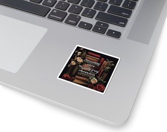 May include: A sticker with a dark background featuring a stack of books with red, white, and pink roses. The text on the sticker reads "Swooning over morally grey characters."