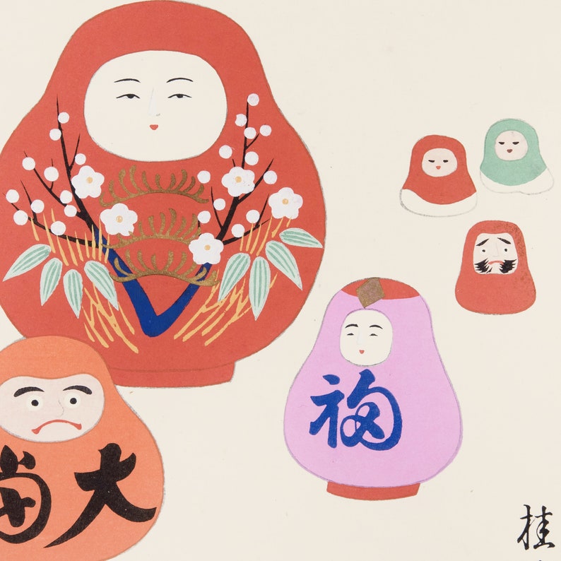 May include: A collection of Japanese Daruma dolls in various sizes and colors. The largest doll is red with white floral accents. Other dolls are orange, pink, and green, some with Japanese characters.