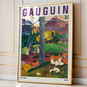 May include: Framed art print of Gauguin's "Mata Mua" painting. The artwork features a vibrant landscape with figures, trees, and a rich color palette of greens, purples, and yellows. The title "GAUGUIN" is at the top, with "MATA MUA" and "1892" at the bottom.