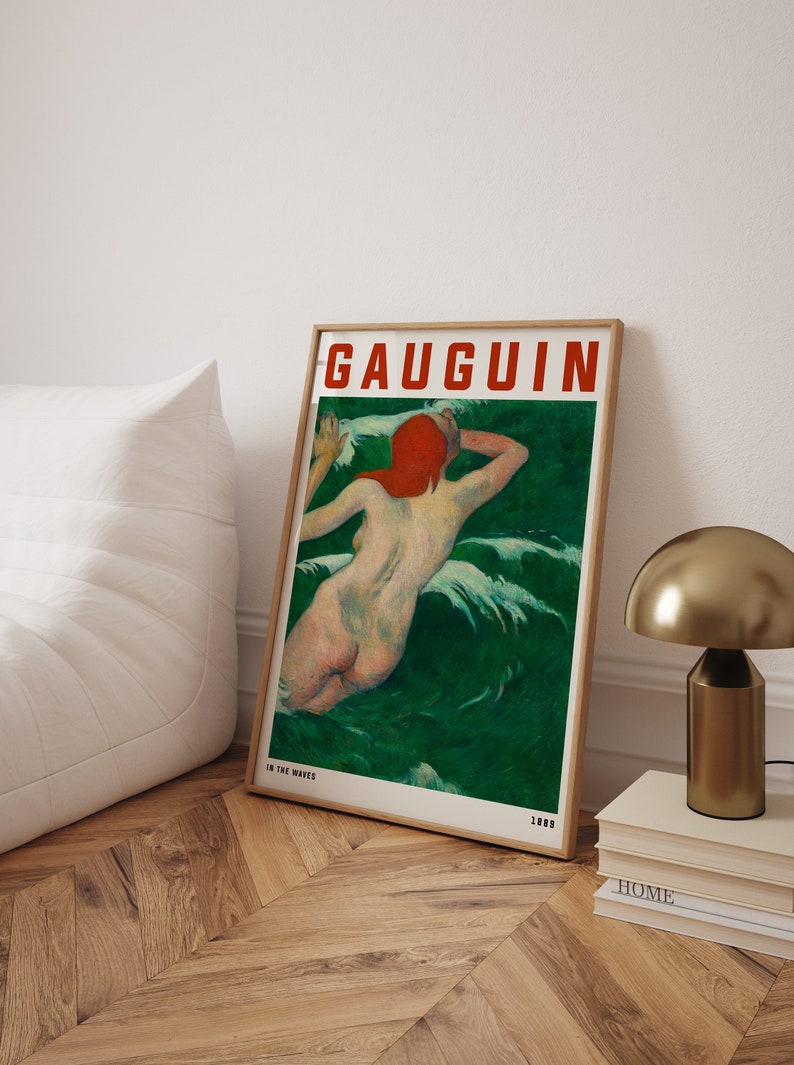 May include: Framed art print of a nude figure in green water, with the text "GAUGUIN" in red. The artwork is titled "IN THE WAVES" and dated 1889. The print is in a wooden frame.