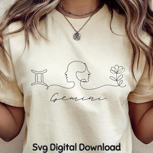 May include: Cream-colored t-shirt featuring a minimalist black line drawing of the Gemini zodiac symbol, two faces, and a flower. The word "Gemini" is written below the design in cursive. The text "Svg Digital Download" is at the bottom.