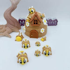 May include: A whimsical, brown beehive with a small door and window, adorned with white daisy accents and several cartoon bees. The bees are yellow and brown with large, expressive eyes. A tree-like structure is in the background.
