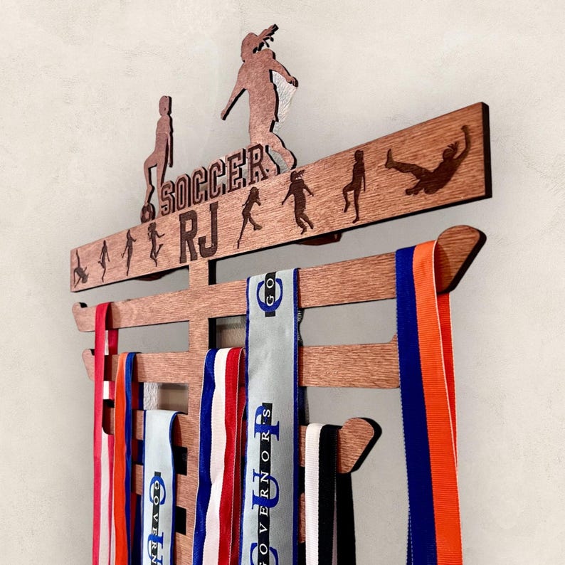 Close up of wood engraved Soccer Medal Stand.