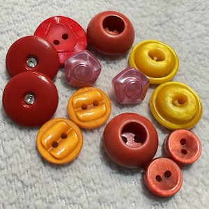 13 Colorful Plastic Vintage Buttons. Bright Hues of Red Rhinestone, Orange, Yellow, Pink, Red. Various Shapes and Sizes. For Sewing.